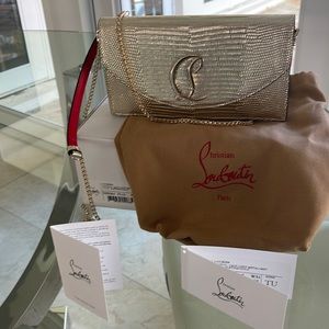 Christian Louboutin gold clutch